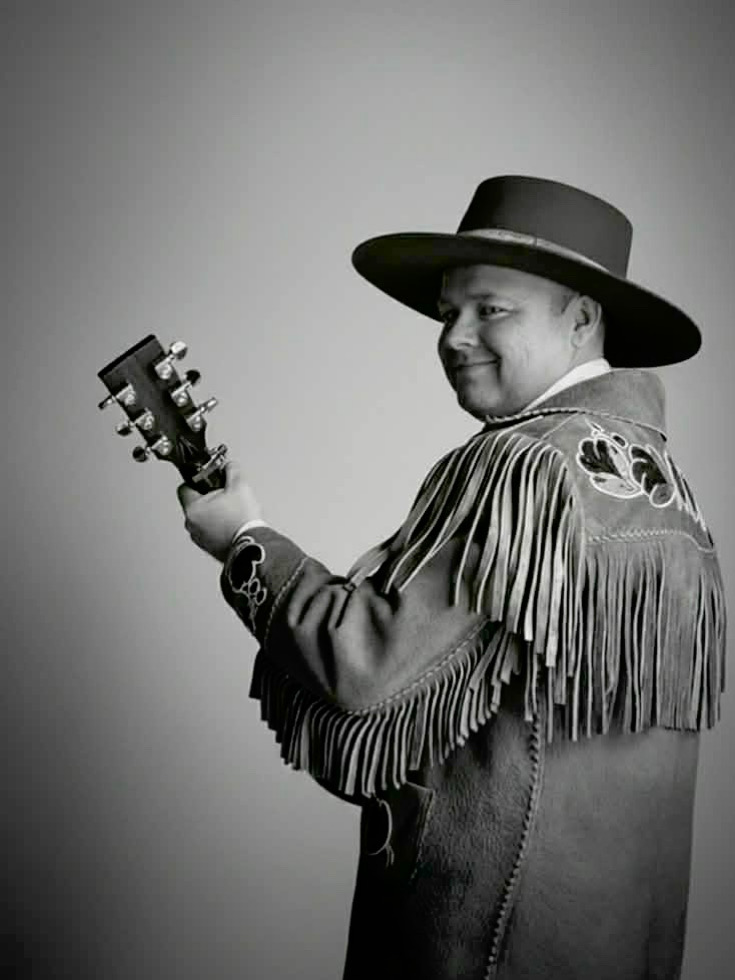 Joshua Beebe holding a guitar